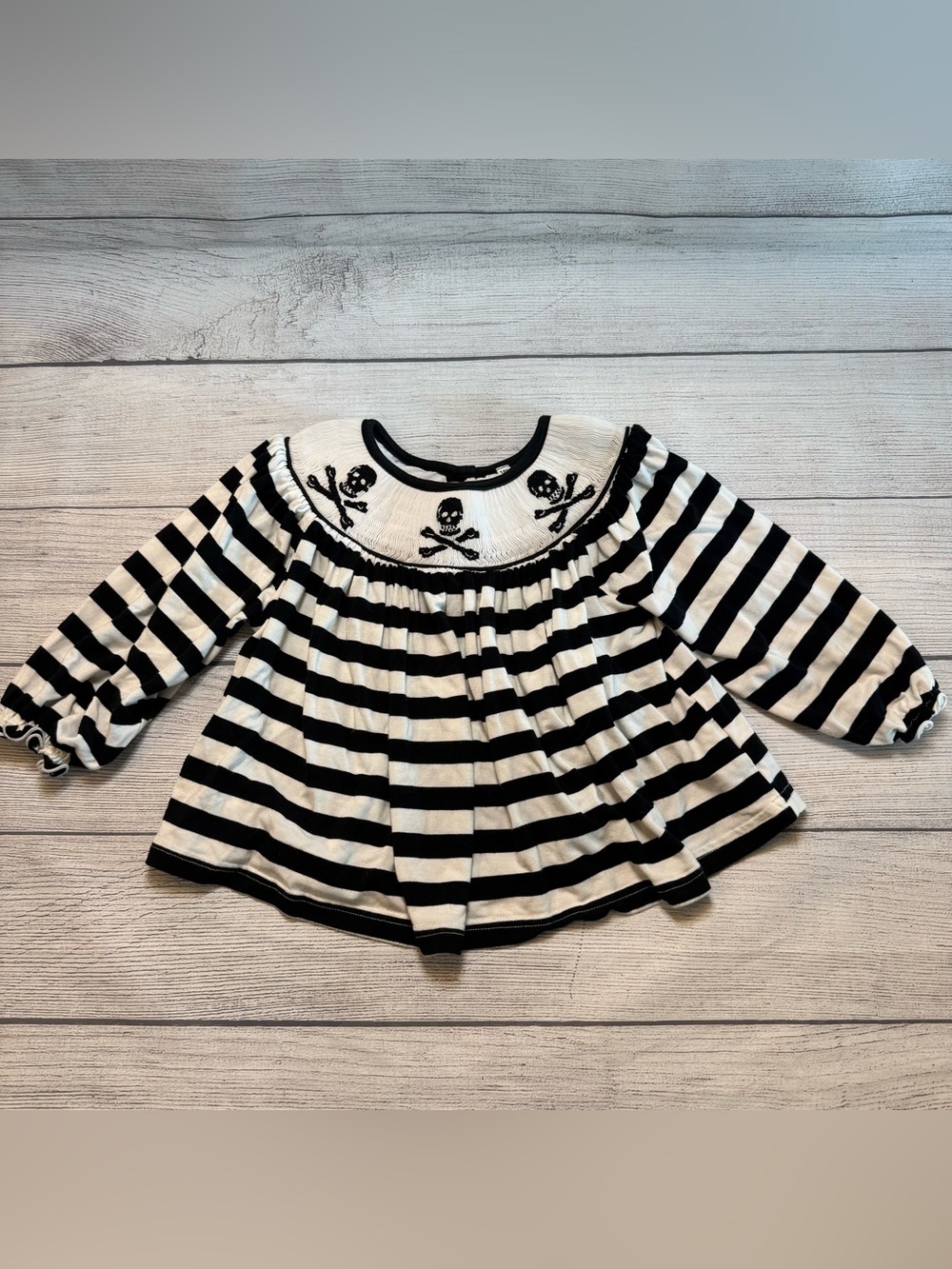 Black & White Striped Smocked Girl’s Long-Sleeve Top with Skull Embroidery